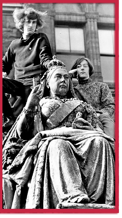 Paul Willis (left) and Michael VadeBoncoeur on a Queen Victoria Statue - photo by Dick Darrell, 1968