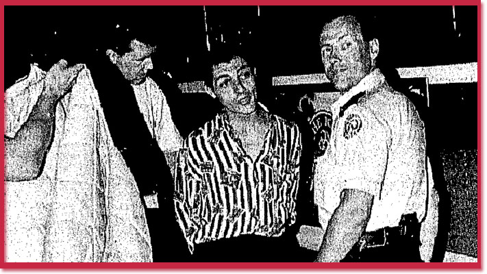 Arrest of Dougal MacDonald by police - photo by Tony Costas